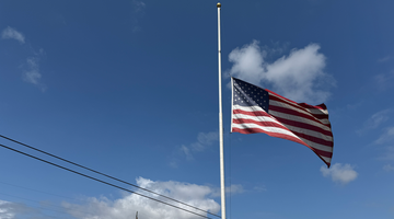 US Flag at Half Staff over Ballistic Armor Co. Headquarters