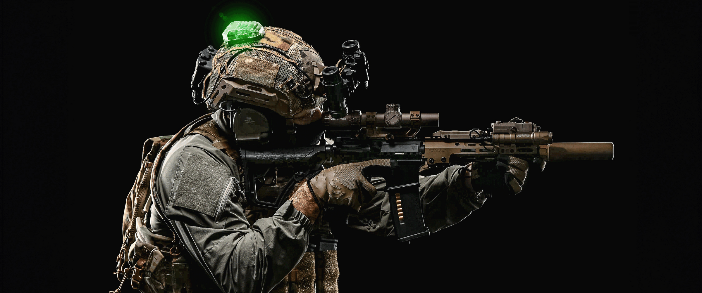 Tactical operator with Bastion M-LOK helmet with night vision and green strobe, pointing rifle forward